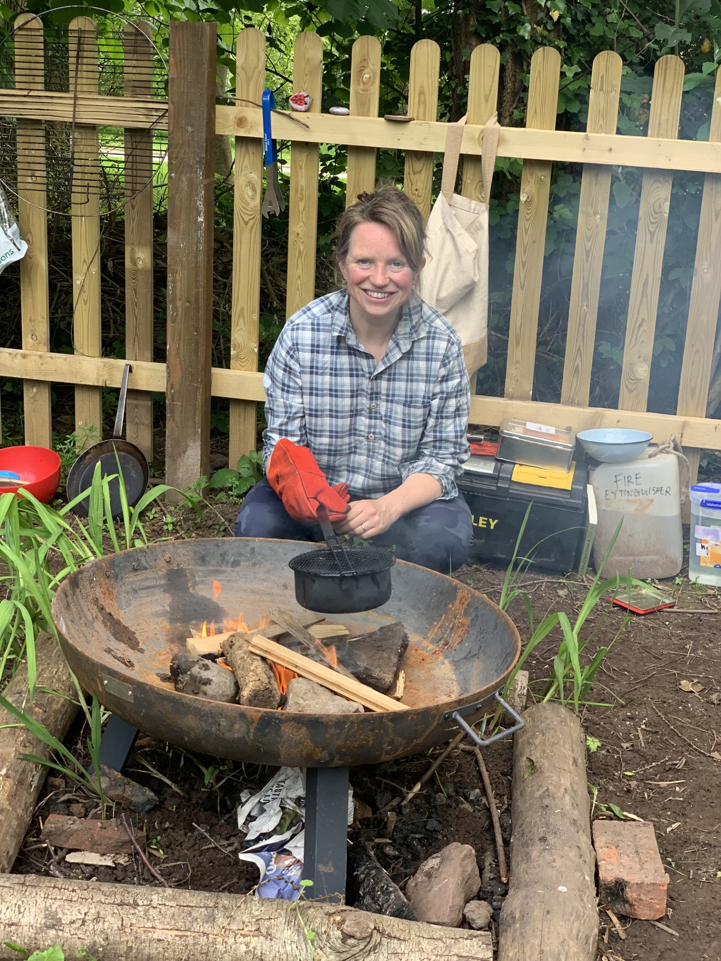 Our Forest Lead cooking popcorn over an open fire