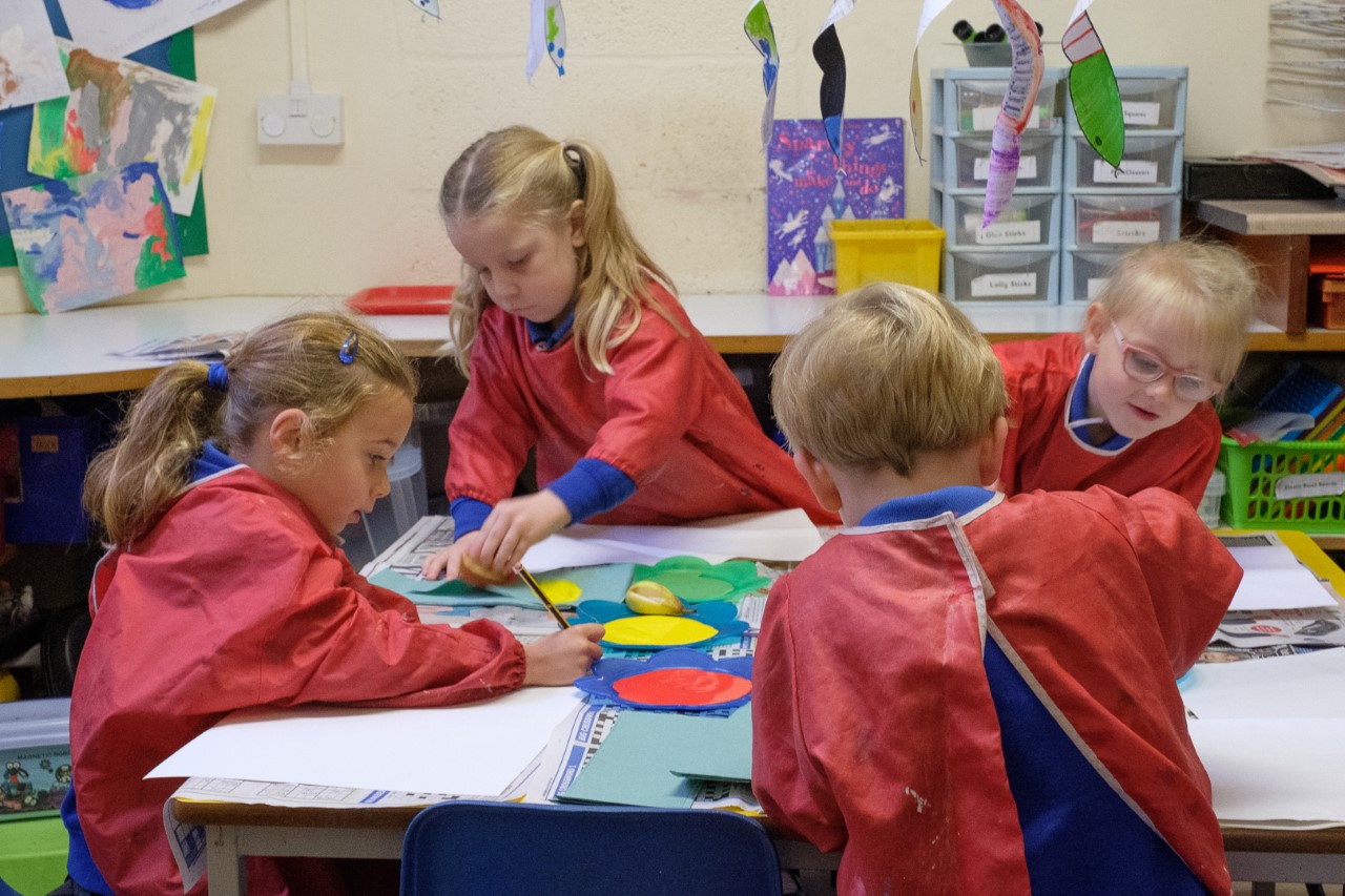 Early years pupils in the art area