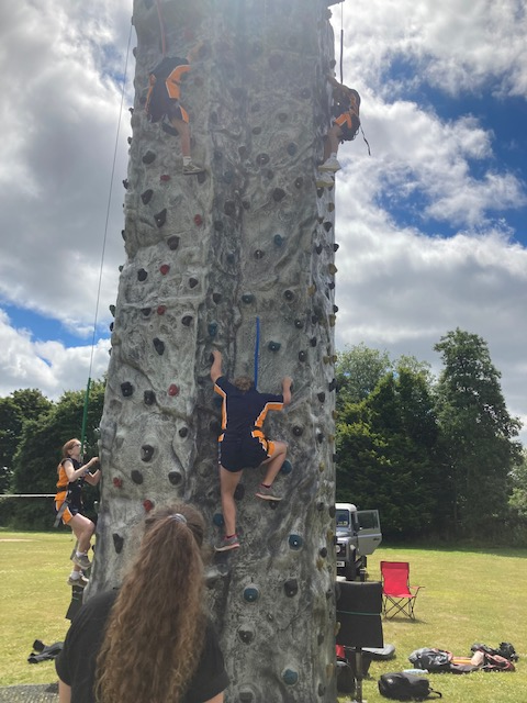 Picture of students climbing a climbing wall