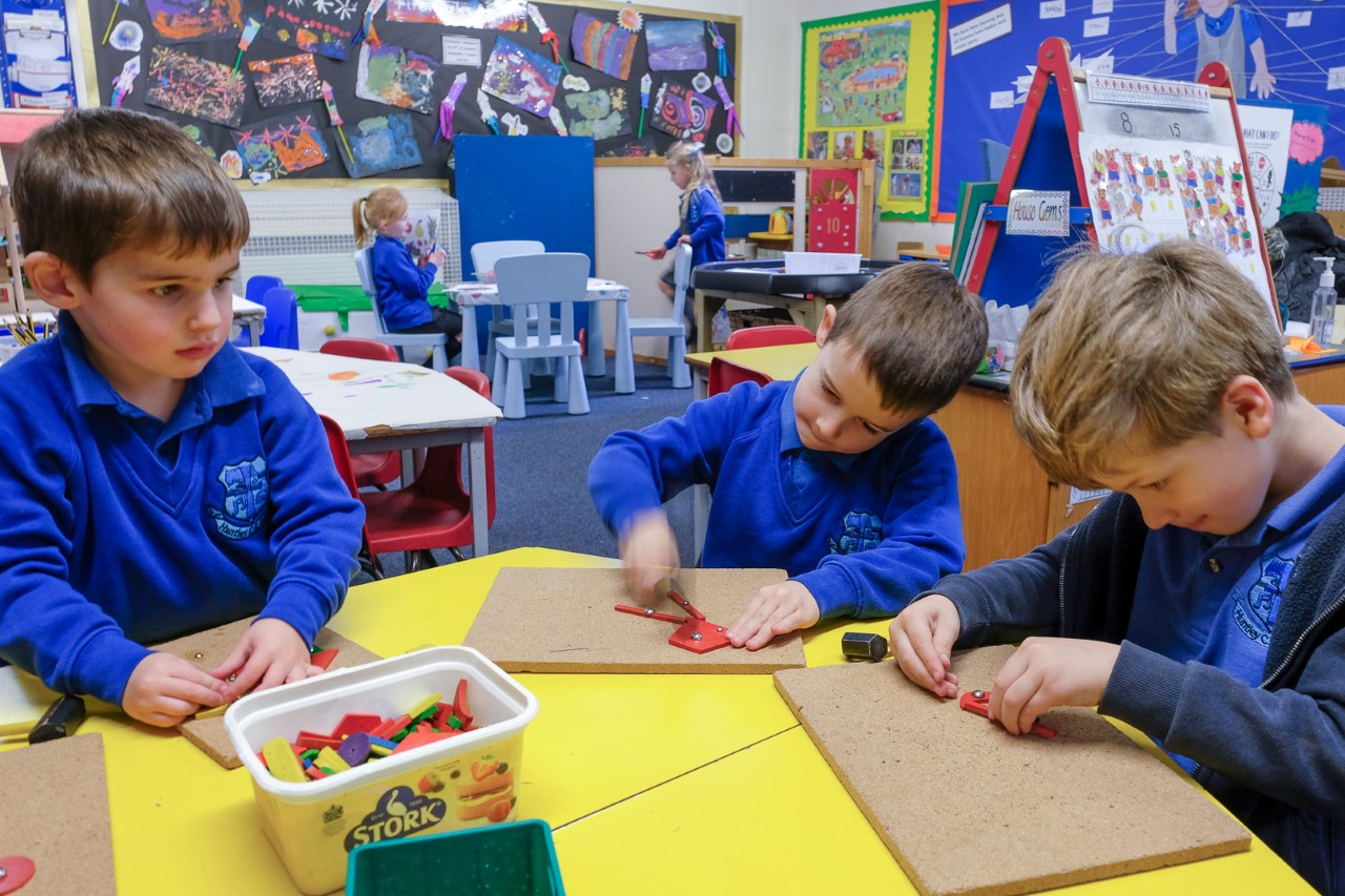 Early years pupils doing various activities in their classroom